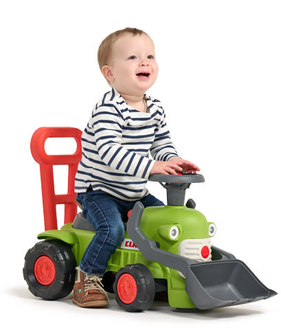 Enfant sur porteur Claas