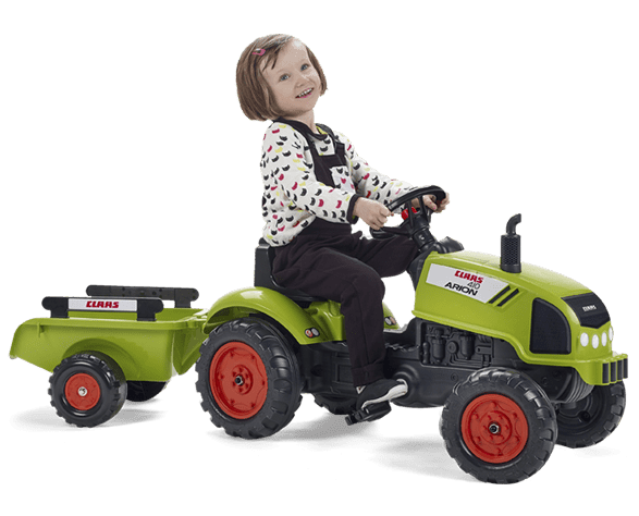 petite fille sur un tracteur vert Falk Toys
