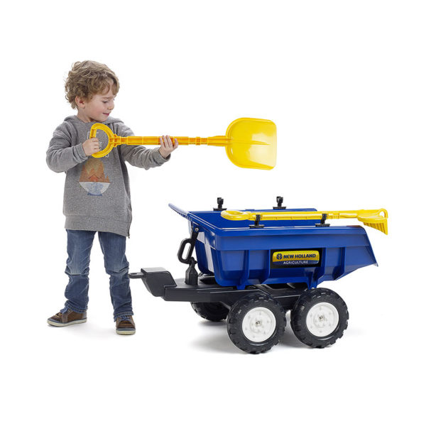 Little boy playing with Falk Toys New Holland Maxi 940NH tipper trailer