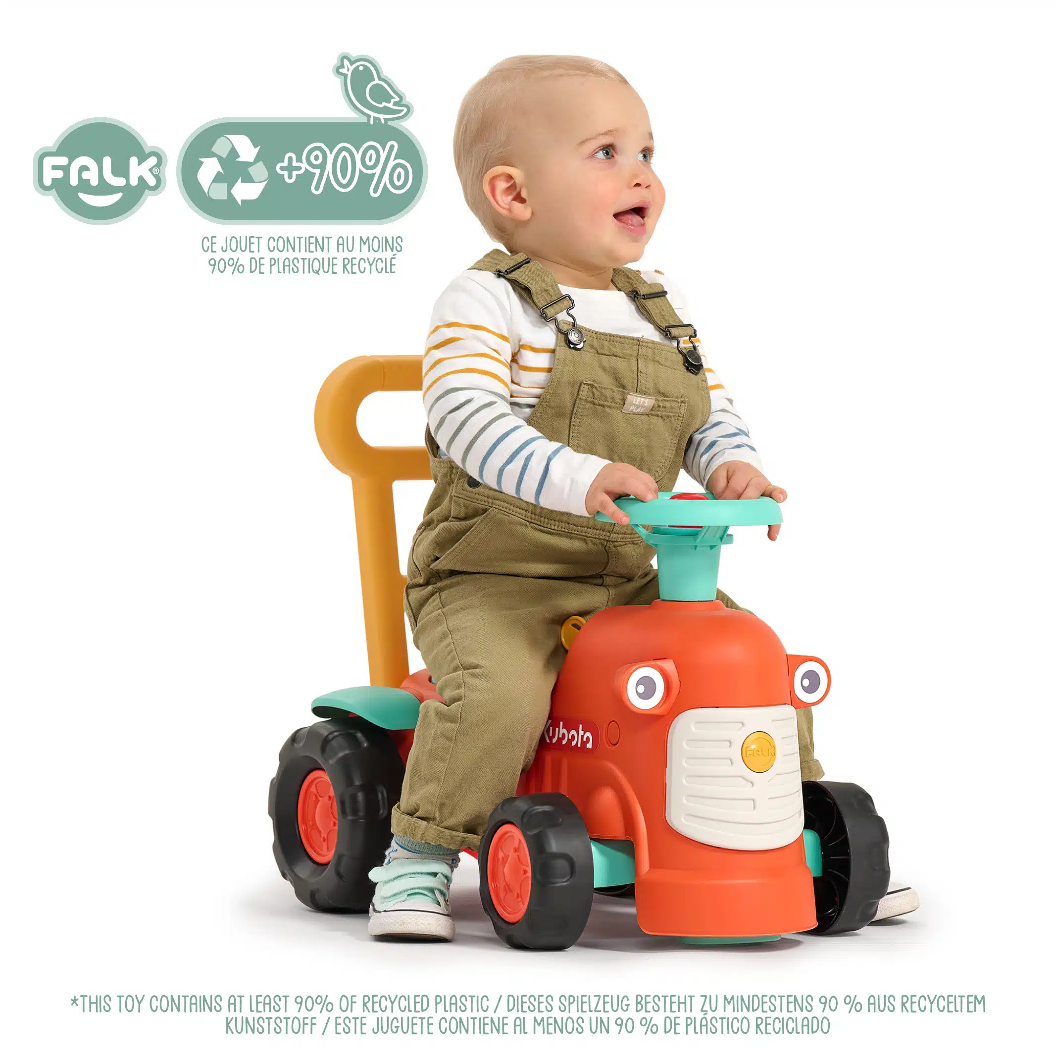 Enfant sur porteur tracteur Kubota