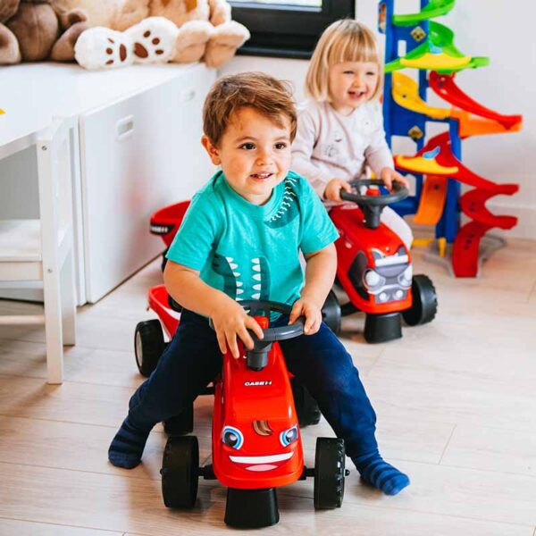 Kids on Ride-on Case IH with trailer