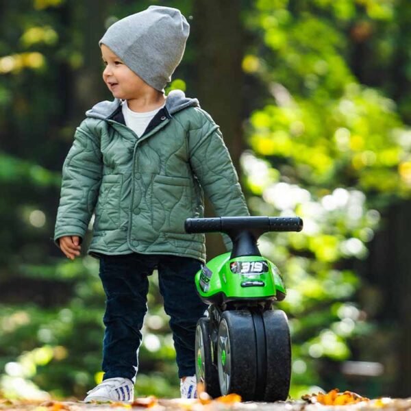 Boy on Draisienne motorbike Bud Racing