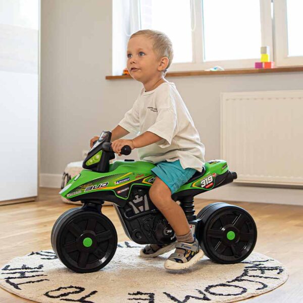 Boy on Draisienne motorbike Bud Racing