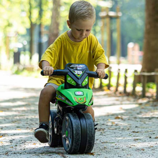 Boy on Draisienne motorbike Bud Racing