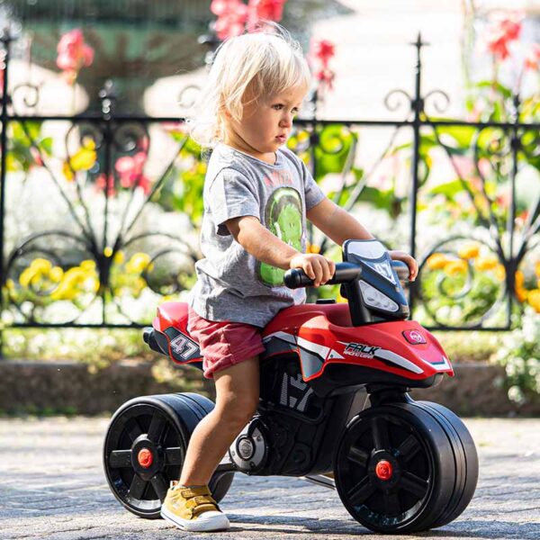 Boy on Draisienne motorbike Falk Racing Team