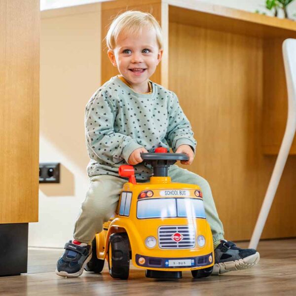 Boy on Ride-on School Bus