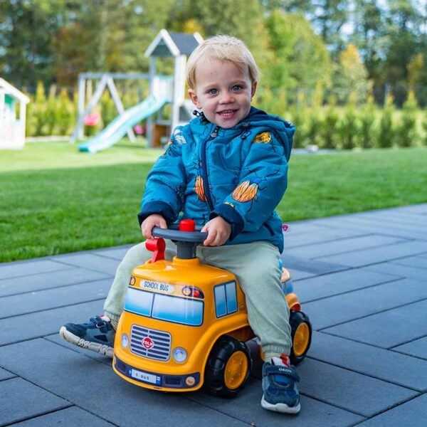 Boy on Ride-on School Bus