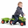 Kid playing with Ride-on Tractor Baby Claas 1012B