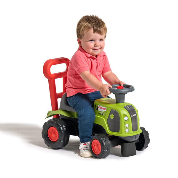 Boy on Ride-on Tractor Claas