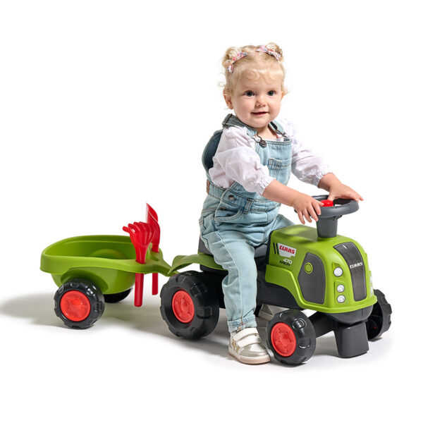 Girl on Ride-on Tractor Claas