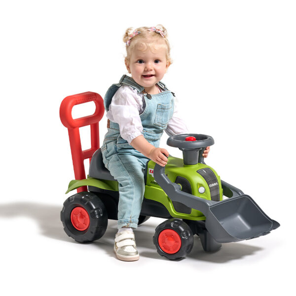 Girl on Ride-on Tractor Claas