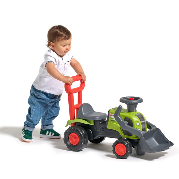 Boy with  Ride-on Tractor Claas