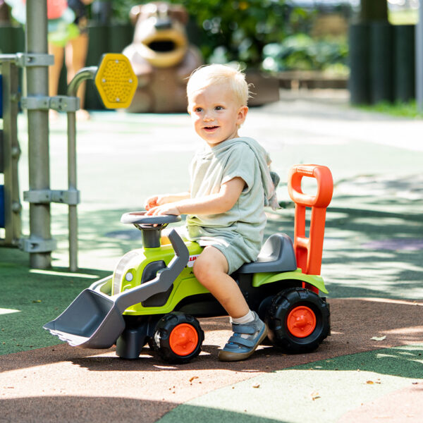 Boy on  Ride-on Tractor Claas