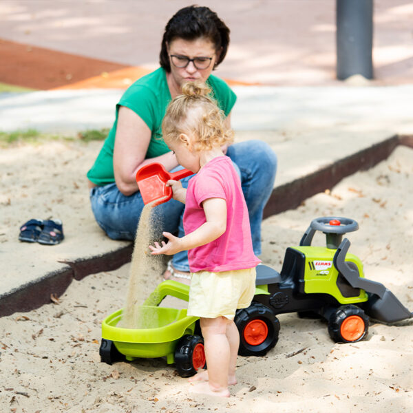 Boy on Ride-on Tractor Claas