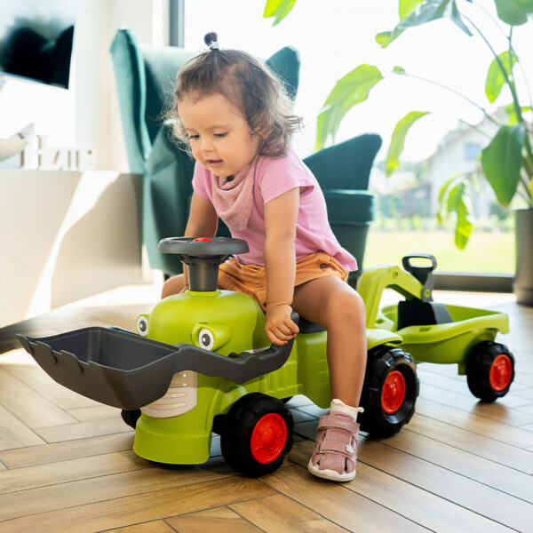 Girl on Ride-on Tractor CLAAS