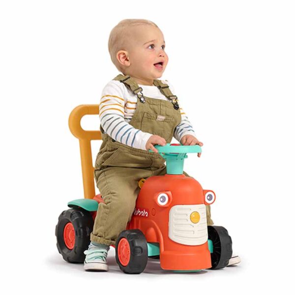 Boy on Ride-on Tractor Kubota