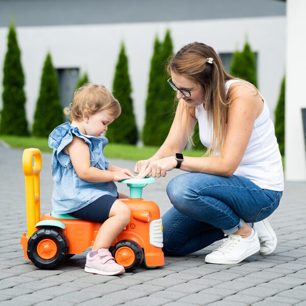 Kid and parent with Ride-on Tractor Kubota