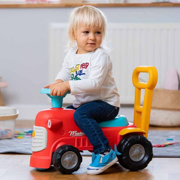 Boy on Ride-on Tractor Maurice red