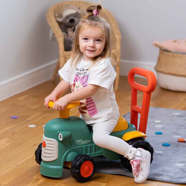 Girl on Ride-on Tractor Maurice green