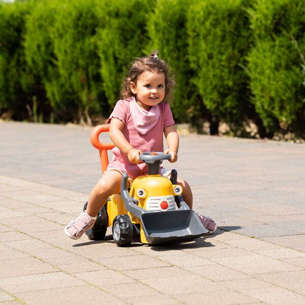 Girl on Ride-on Tractor Maurice with front shovel