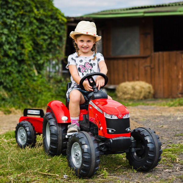 Kid playing with Pedal tractor Massey Ferguson red 4010AB