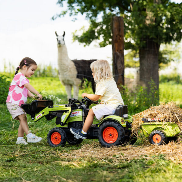 Enfants sur tractopelle à pédales Claas avec remorque 2040AM