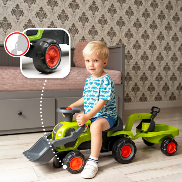 Enfant sur Porteur tracteur Claas