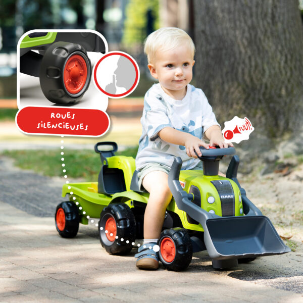 Enfant sur Porteur tracteur Claas